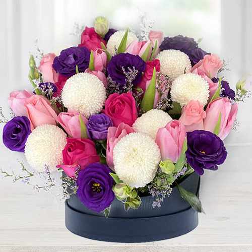 A box of Pink Roses and stalk Tulips