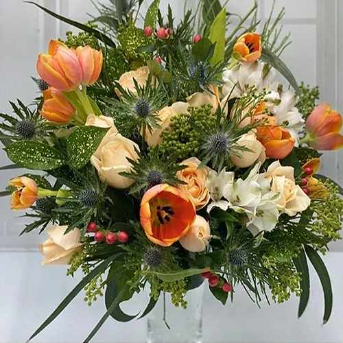 Orange Tulips with Bright Flowers in a Vase 
