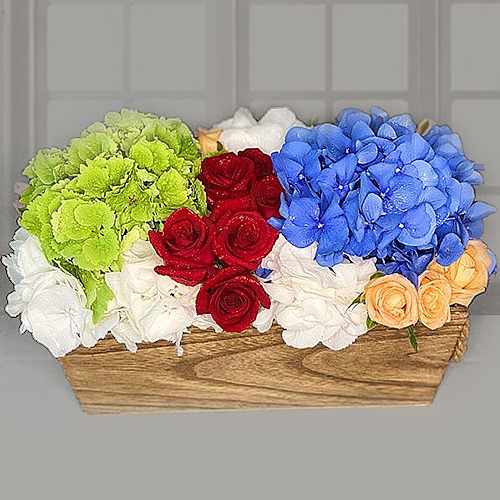 Multicolour Hydrangeas and Roses in wooden tray