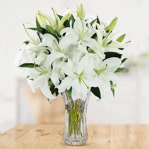 White Lilies in clear Glass Vase