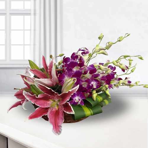 Arrangement of Pink lilies and Purple Orchids