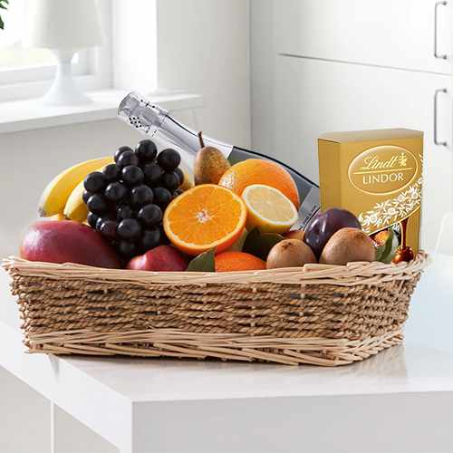 Basket of Juicy Fruits, Chocolates, Statis and Wine