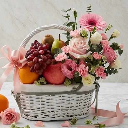 Seasonal Fruits with Rose Gerbera in a Basket