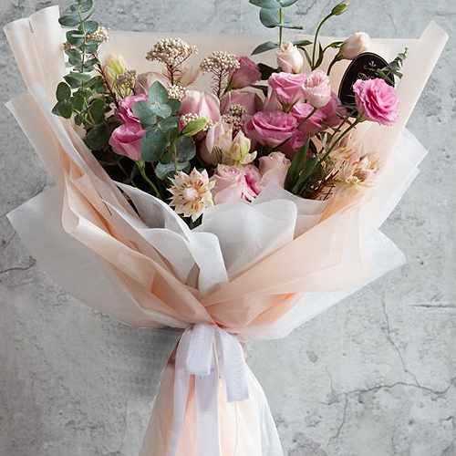Hand Bouquet of Eustomas, Pink Roses  and Rice Flowers
