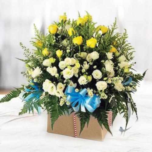 Yellow and White Funeral Arrangement