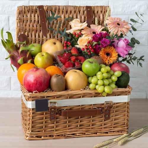Fruits And Flowers In Picnic Basket